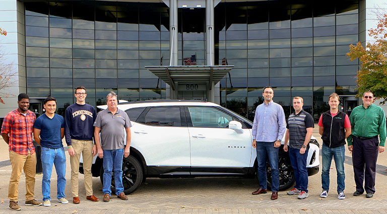 UT’s 2018-19 EcoCAR team stands with the car they will be modifying for this year’s competition, a Chevy Blazer.